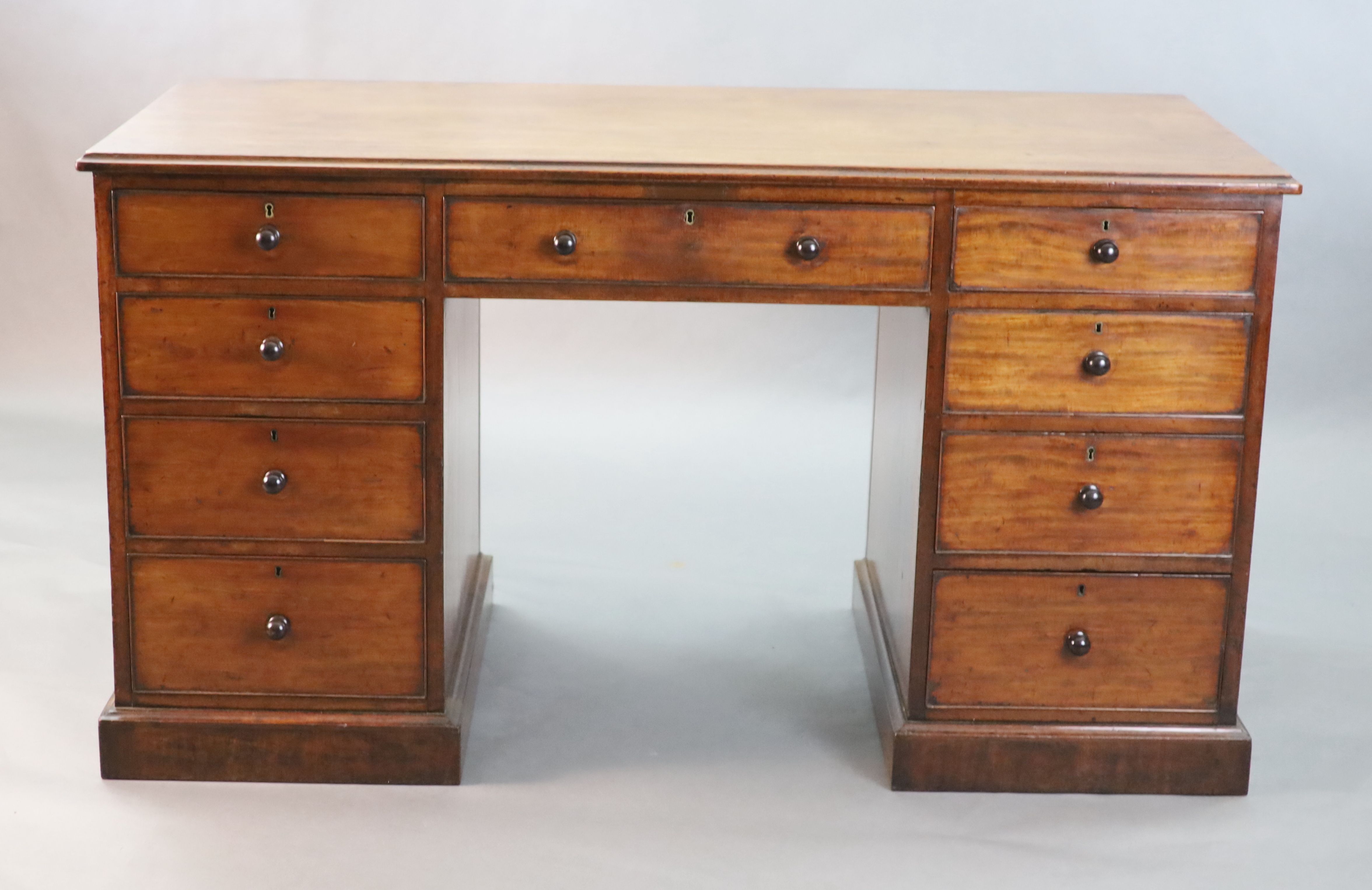 A George III mahogany kneehole desk, W.4ft 8in. D.2ft 2in. H.2ft 7in.